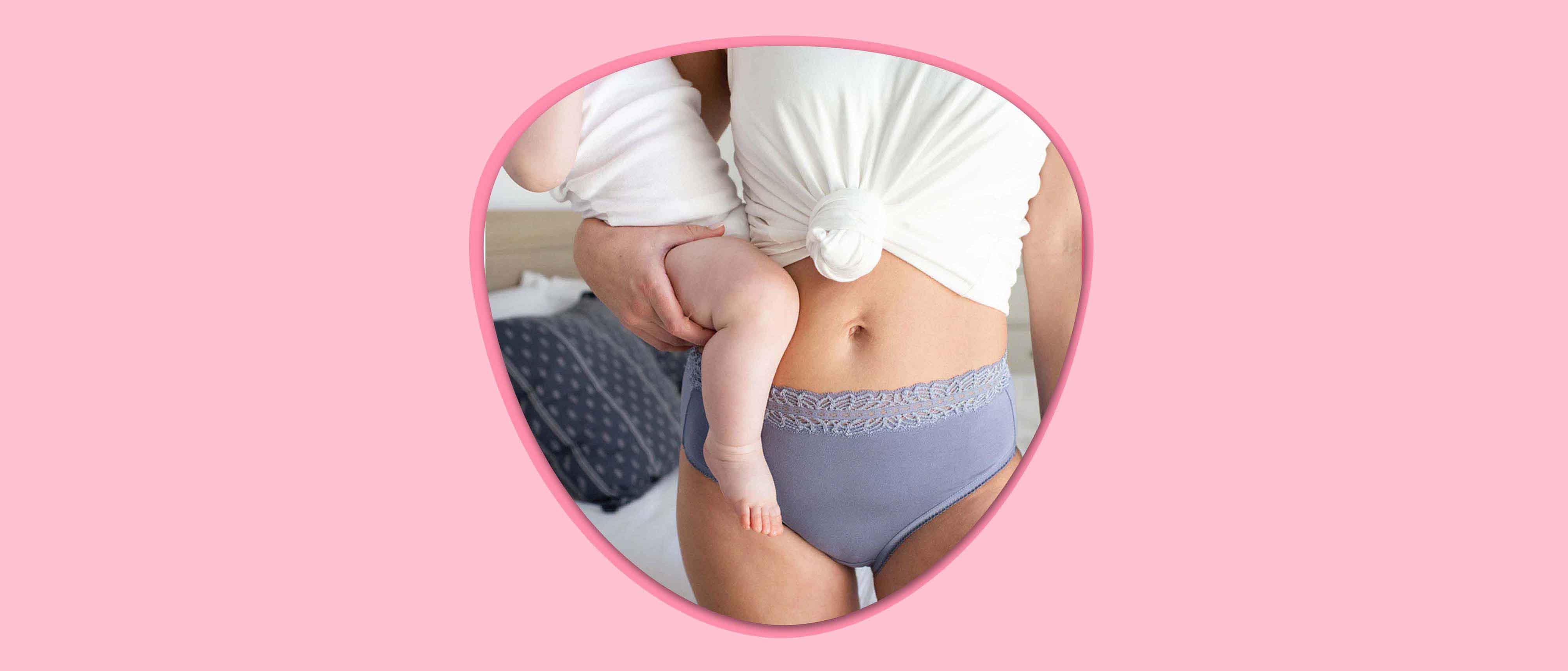 Image of mom in underwear holding a baby