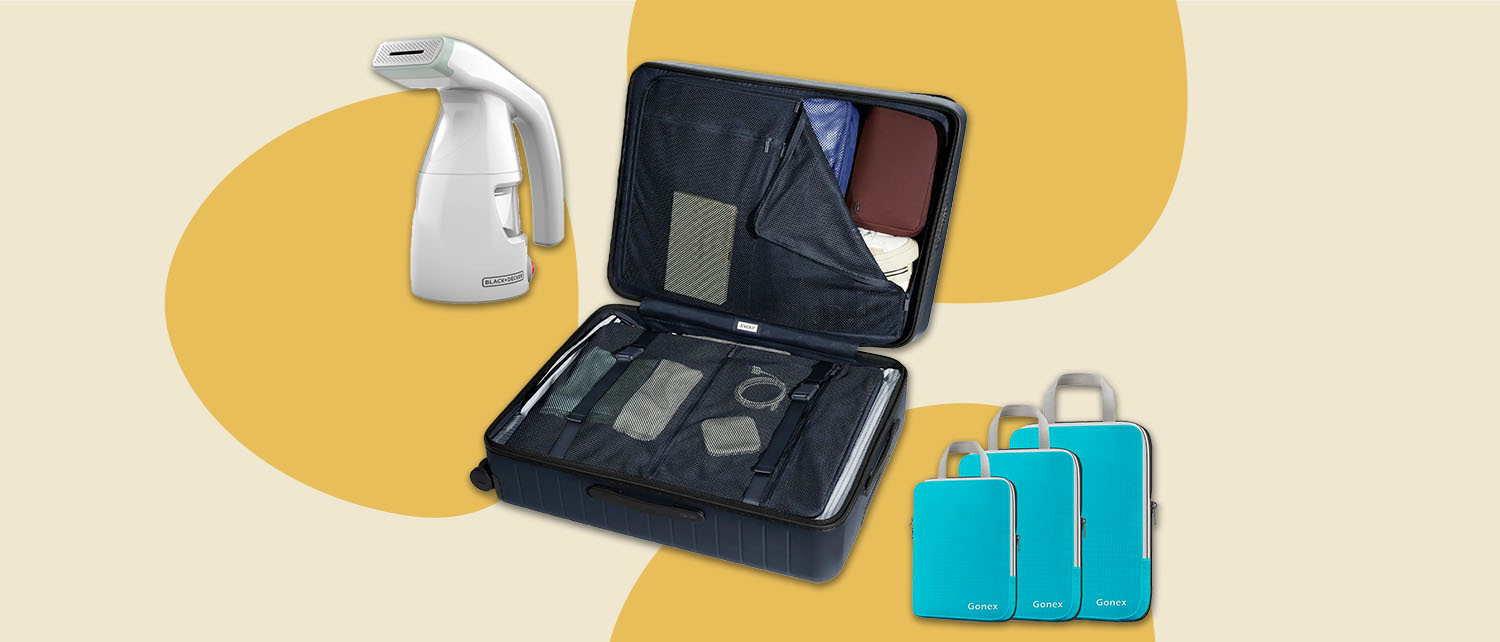 blue packing cubes, an open suitcase and a white steamer on a yellow background
