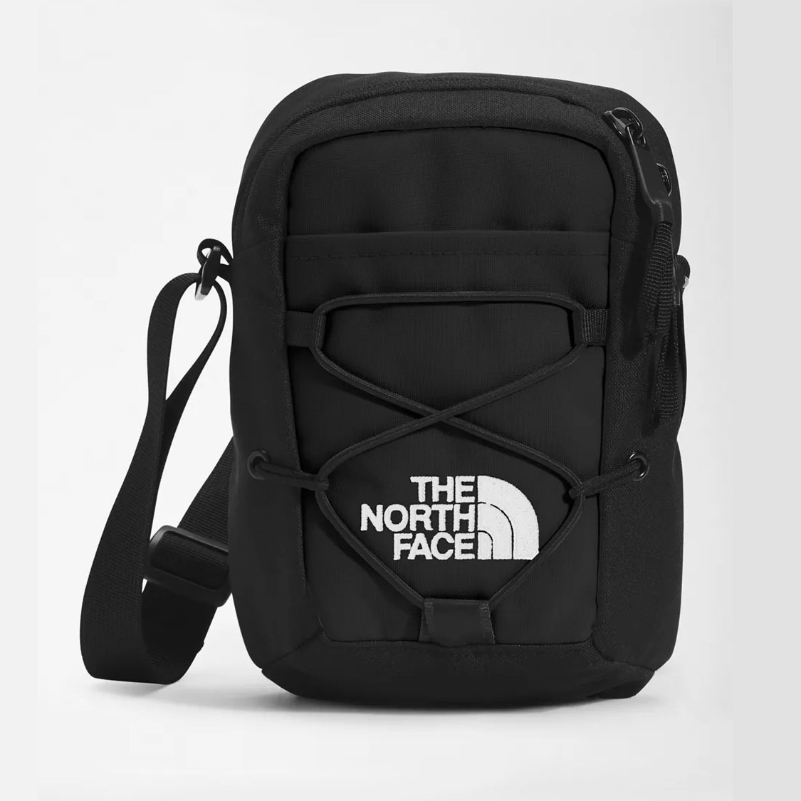 The North Face Jester Crossbody Pack in black with bungee detail 