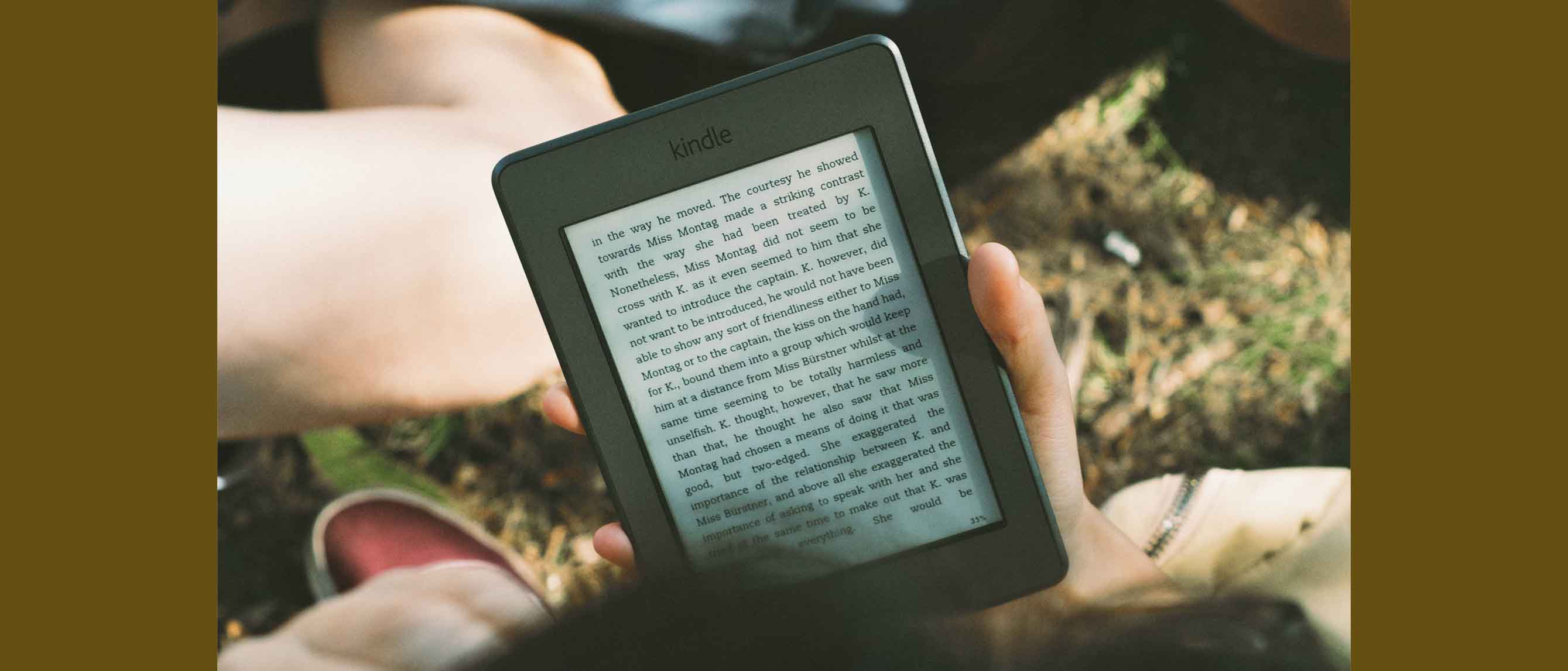 Image of person reading Kindle
