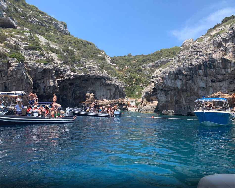 boats on water by some cliffs in Split, Croatia