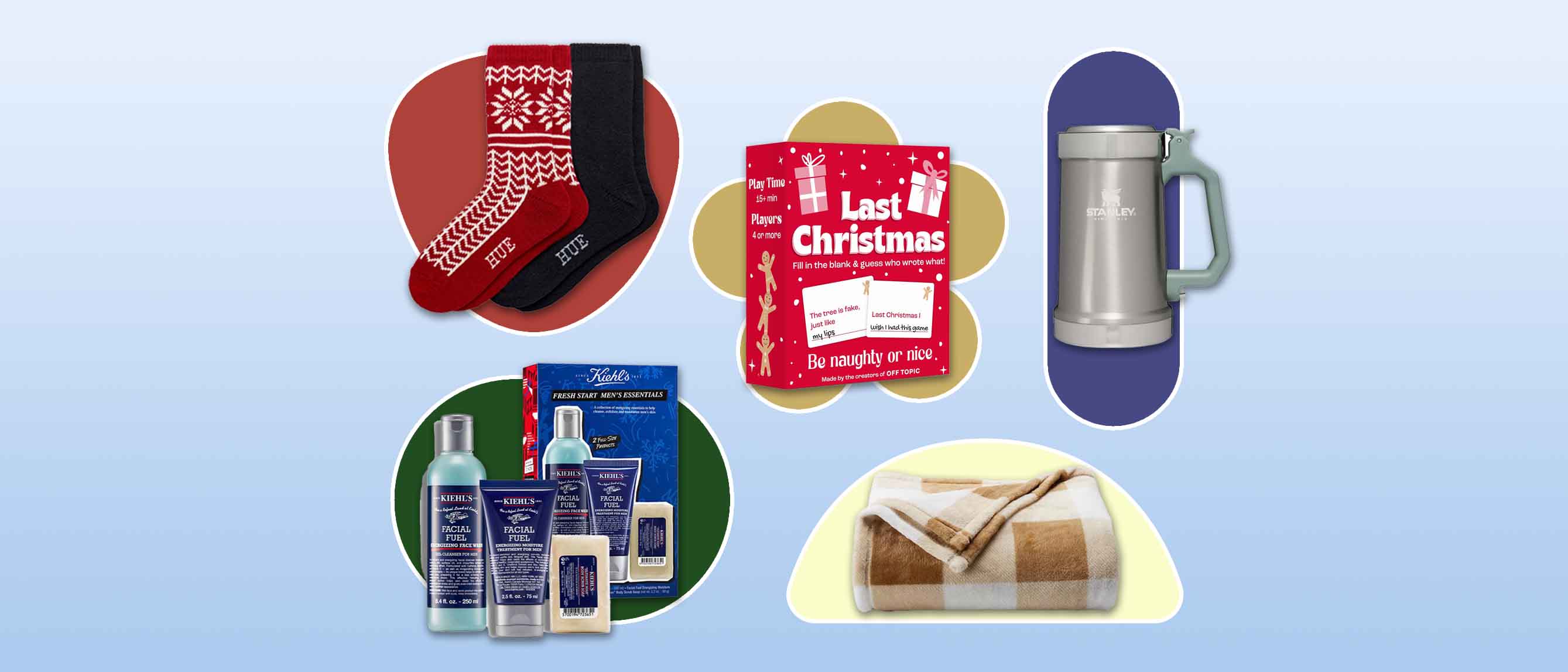 a selection of gifts including socks, card game, Kiehl's men skincare set, a brown throw and Stanley cup