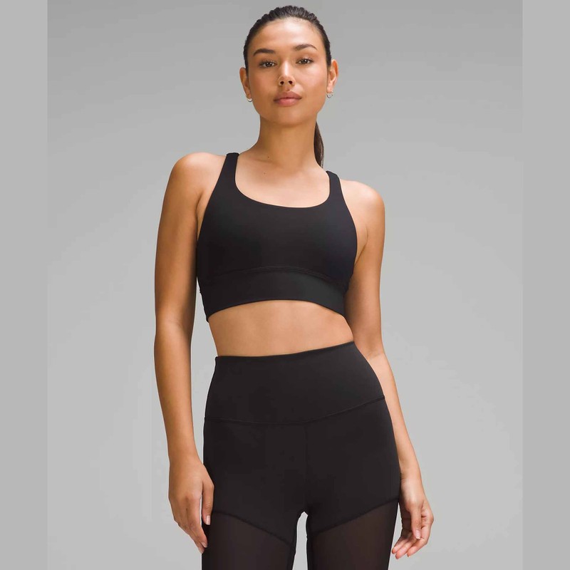 model wearing lululemon Energy Longline Bra Medium Support in black with matching leggings