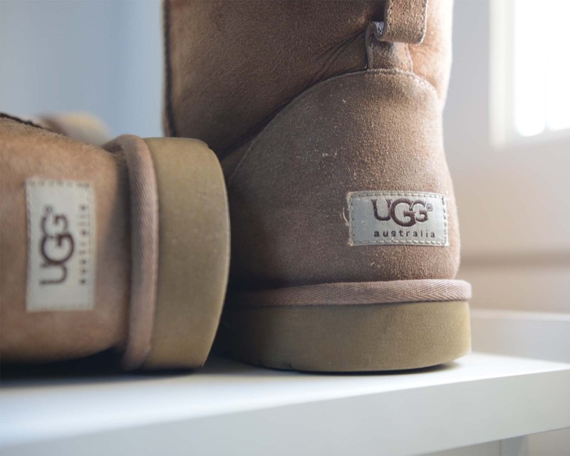 a close up shot of the back sole of a pair of brown ugg boots