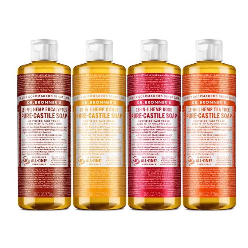 Row of Dr Bronner's Pure Castile Soap with different colors of brown, yellow, red and orange labels