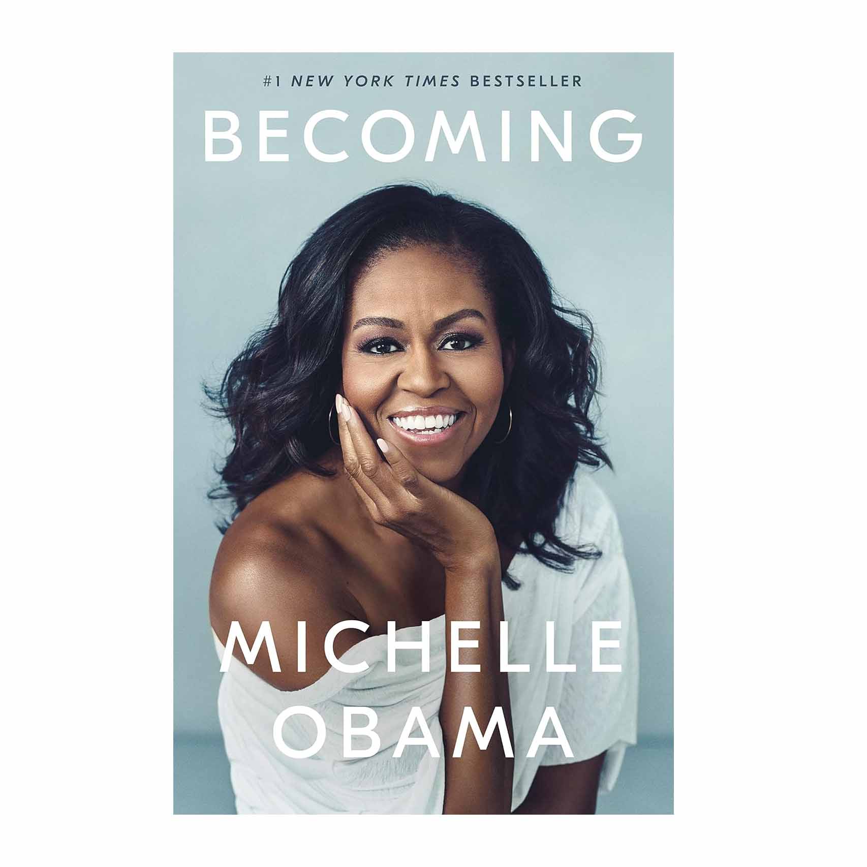 light blue book titled Becoming with a portrait of Michelle Obama 