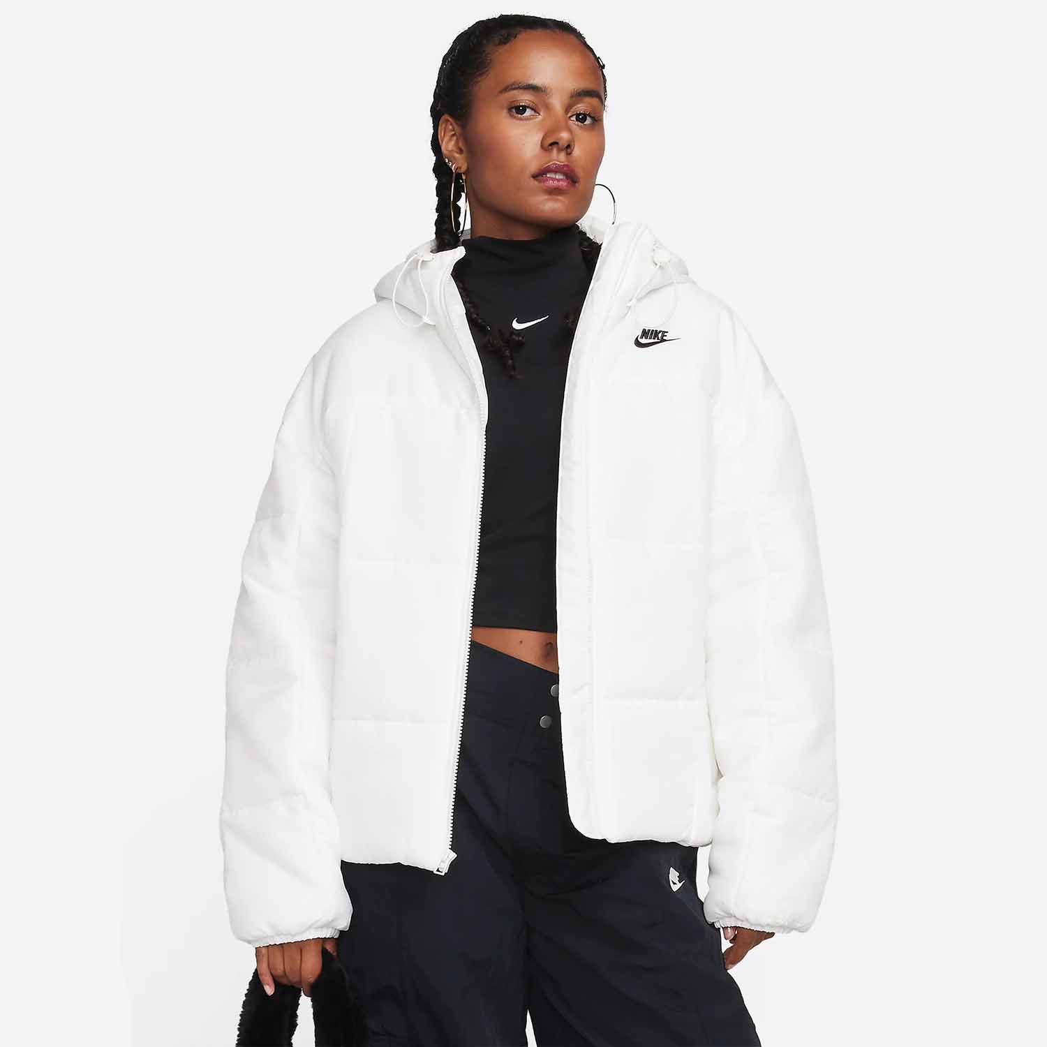 model wearing white nike puffer jacket