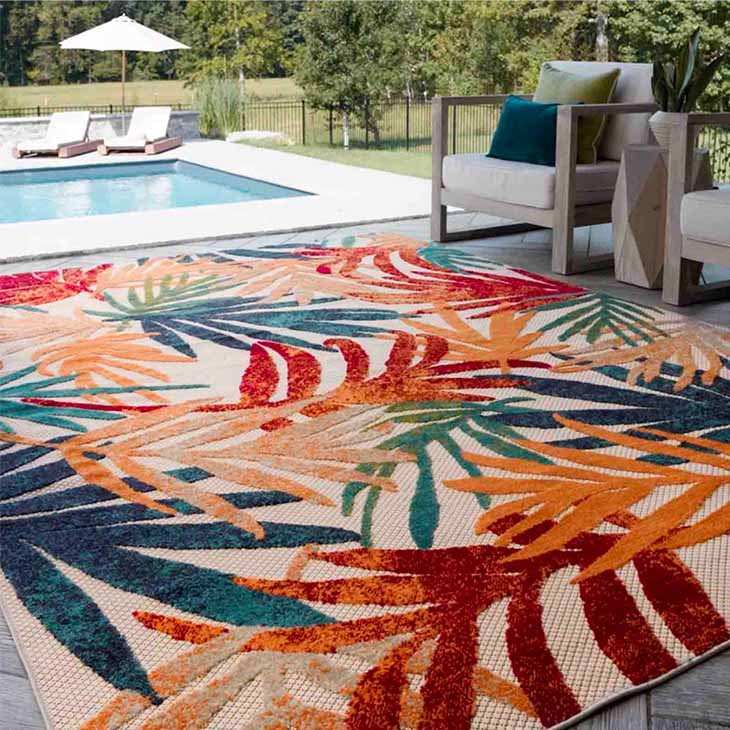 Colorful orange and green tropical rug in outdoor setting