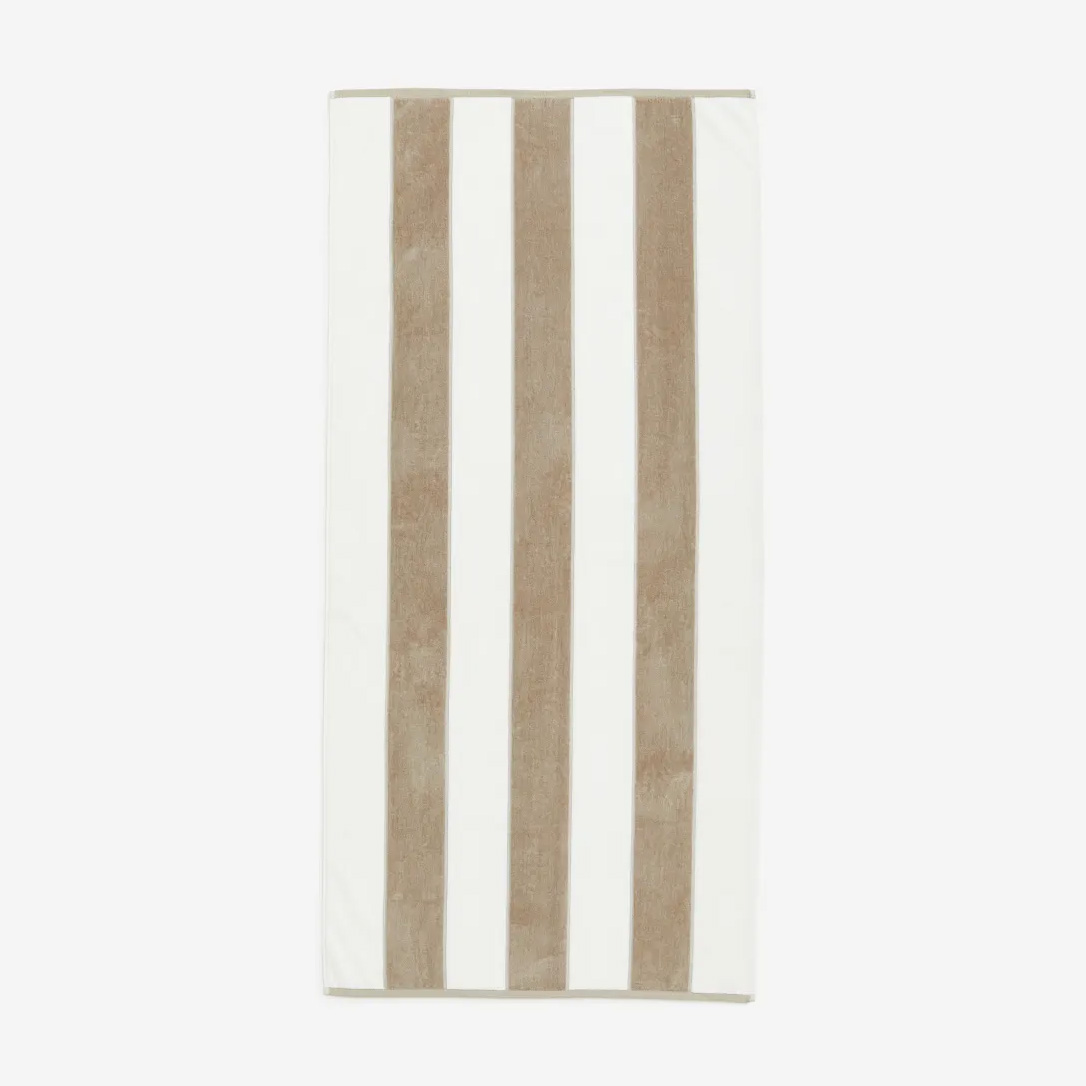 the H&M Beach Towel in white and beige stripe design