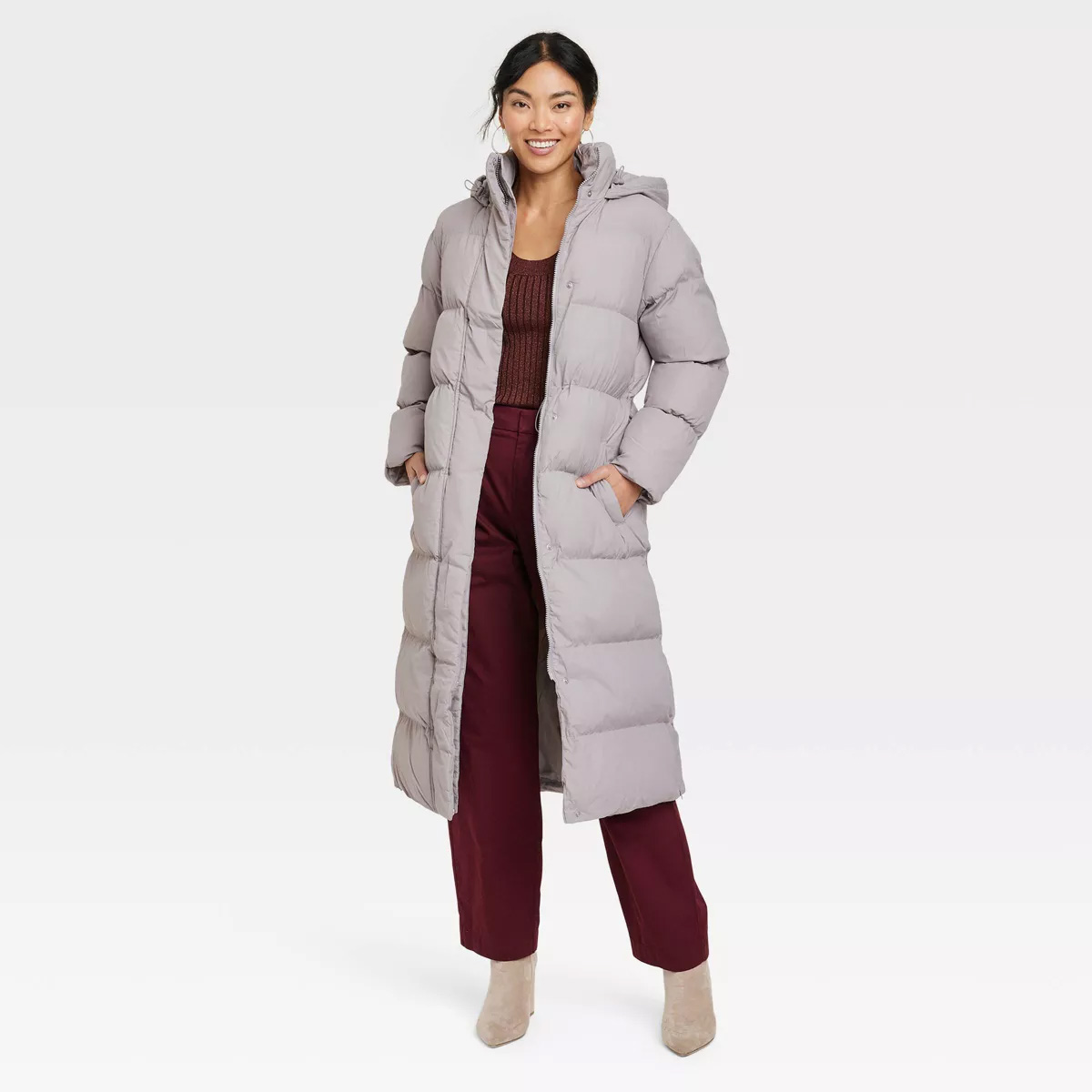 woman wearing the A New Day Women's Relaxed Duvet Puffer Jacket in gray