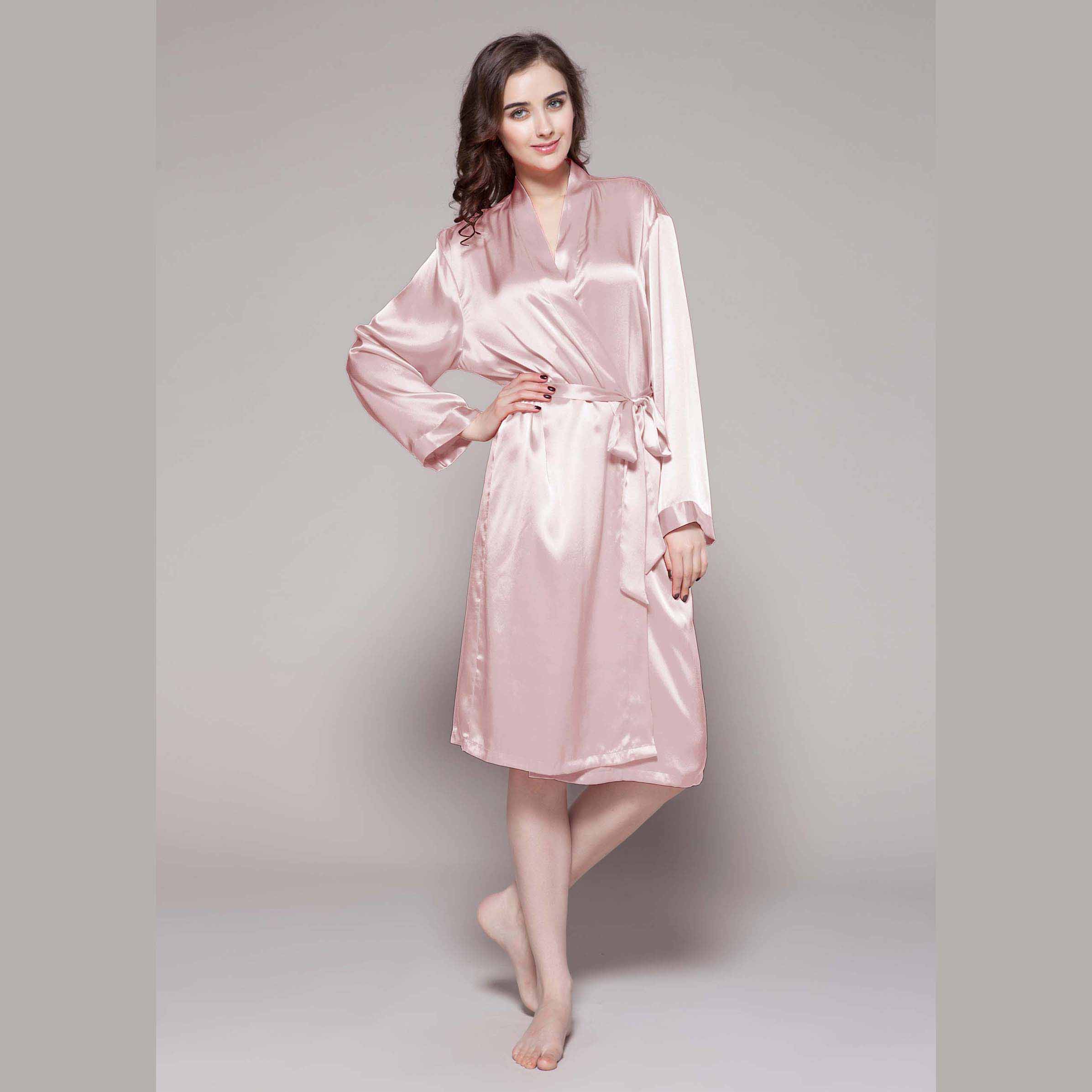 woman wearing a light pink, long robe made from LilySilk