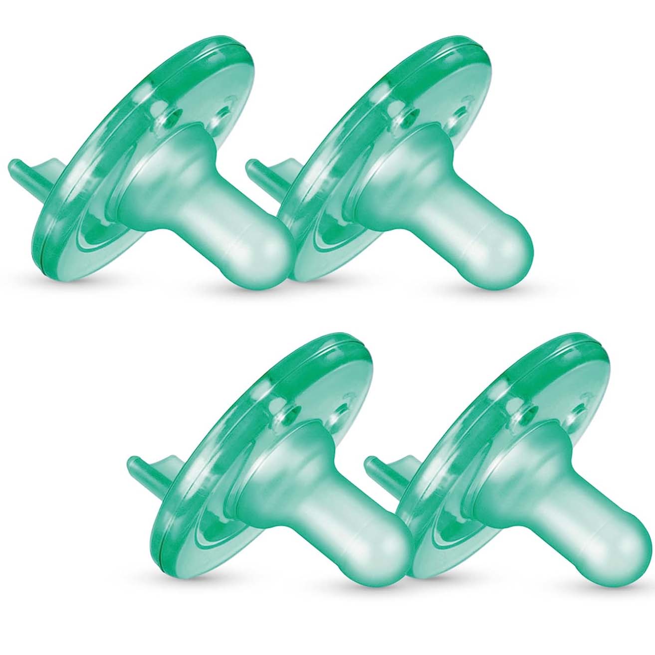 Four translucent green pacifiers