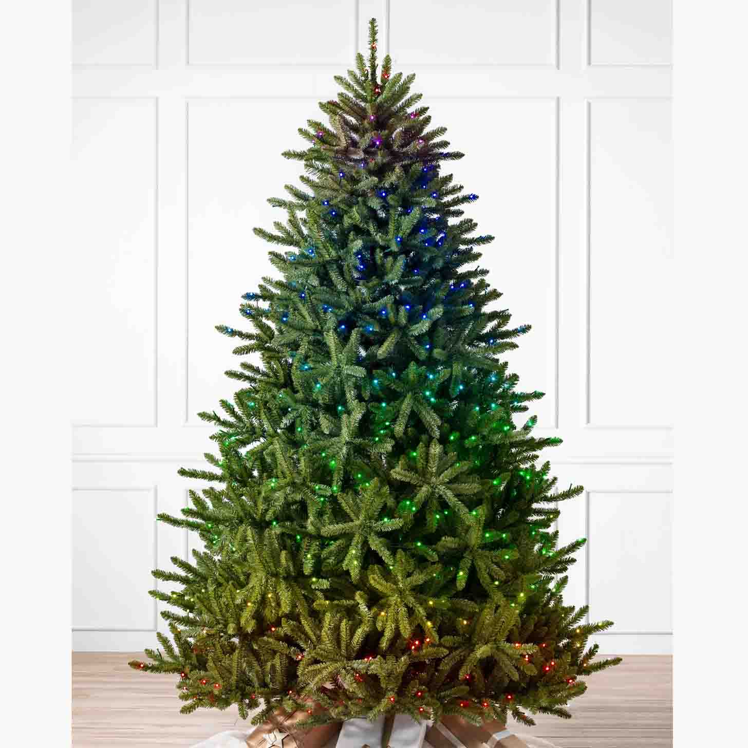 classic blue spruce artificial Christmas tree with candlelight clear LED lights