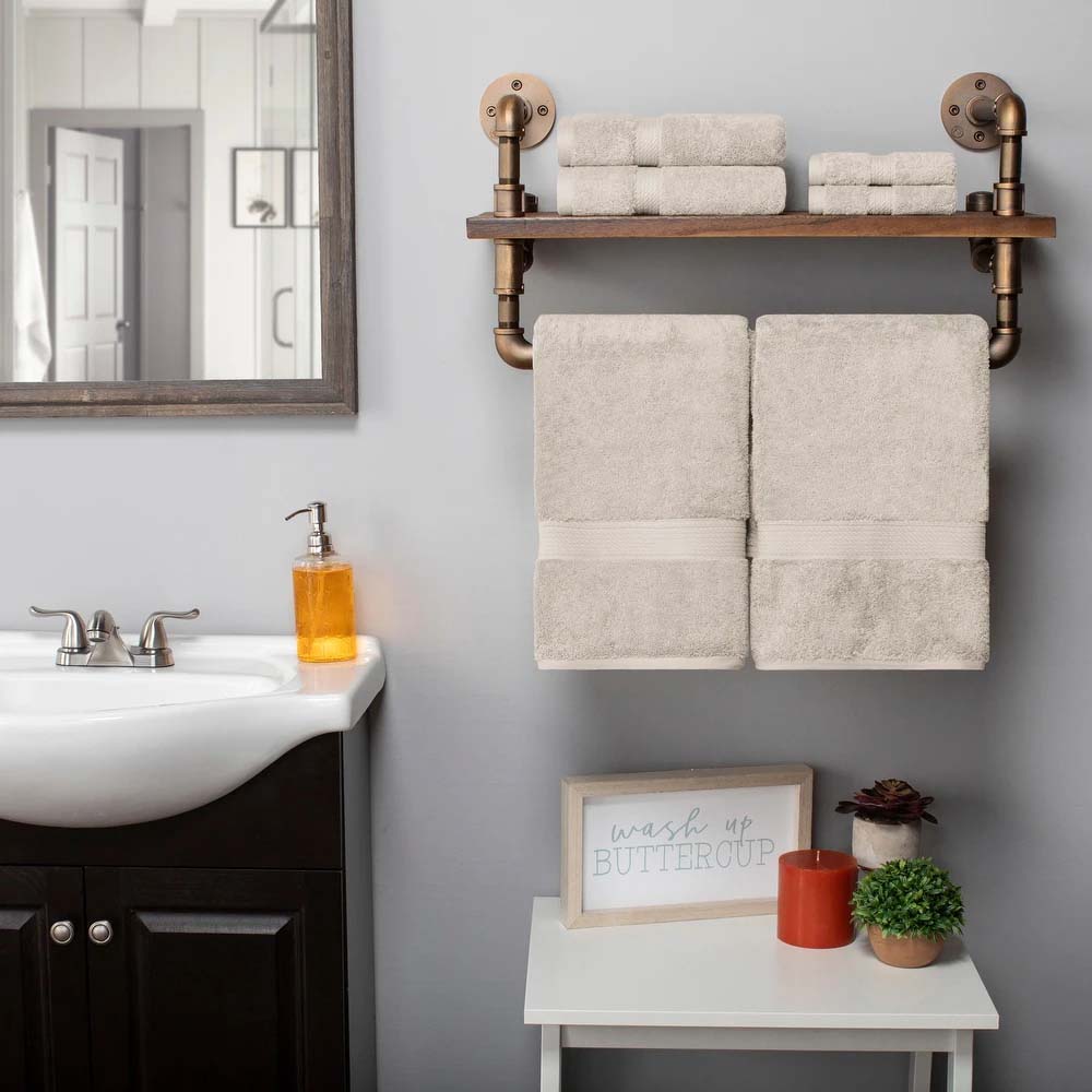 a four pack of Egyptian Cotton Plush Towels in stone inside a bathroom