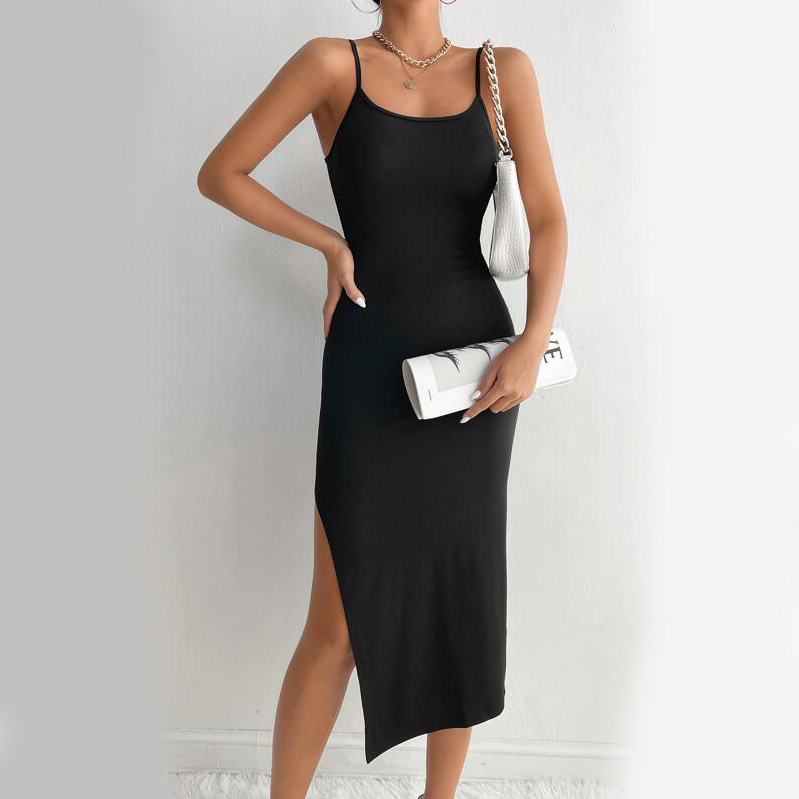 model posing in black midi dress