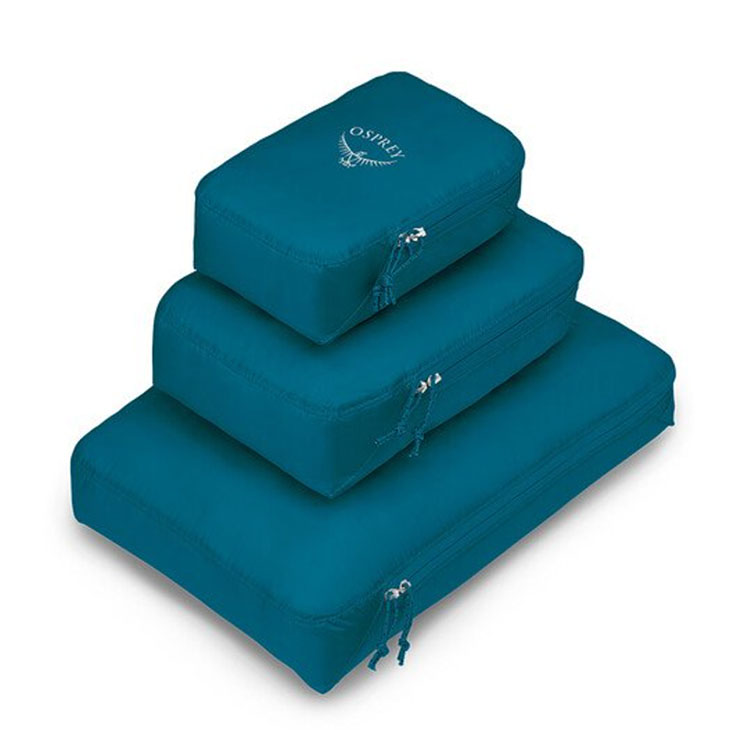 Blue packing cubes stacked on each other