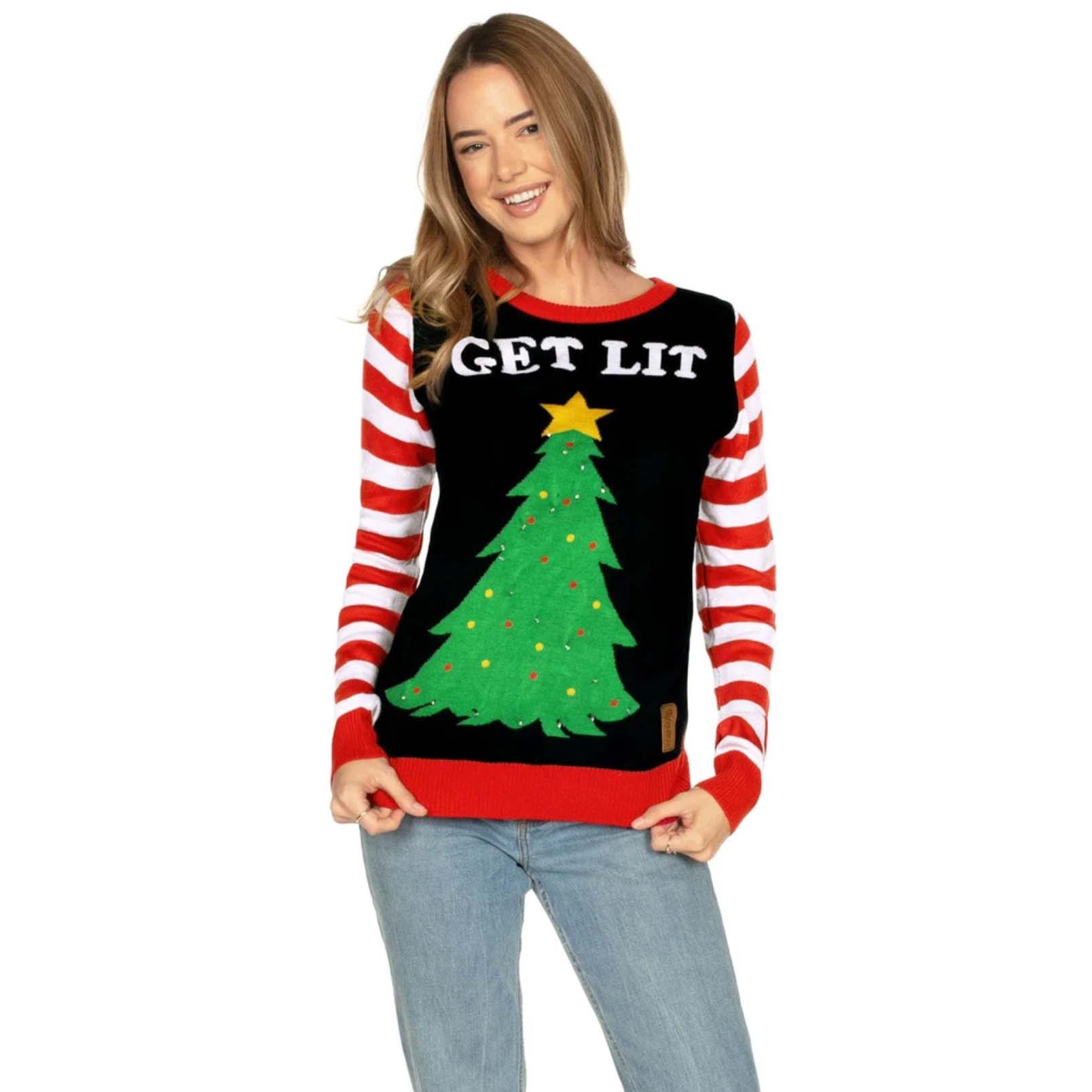 Woman wearing sweater with light up Christmas tree