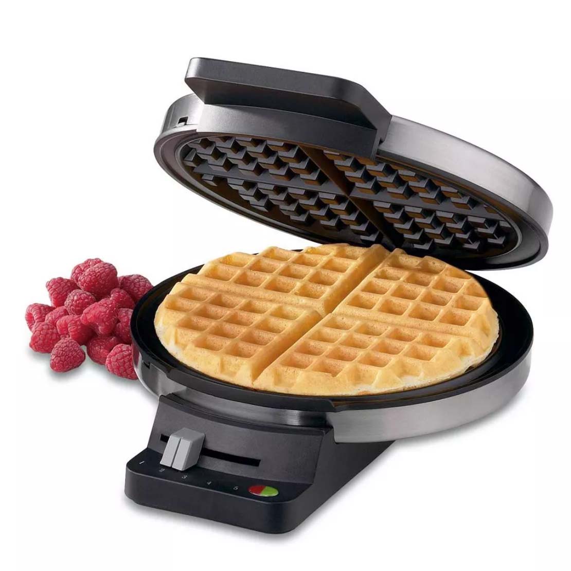 Waffle maker with waffle and raspberry