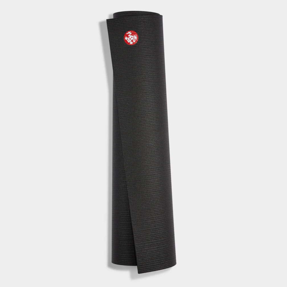 Rolled black yoga mat with round red logo