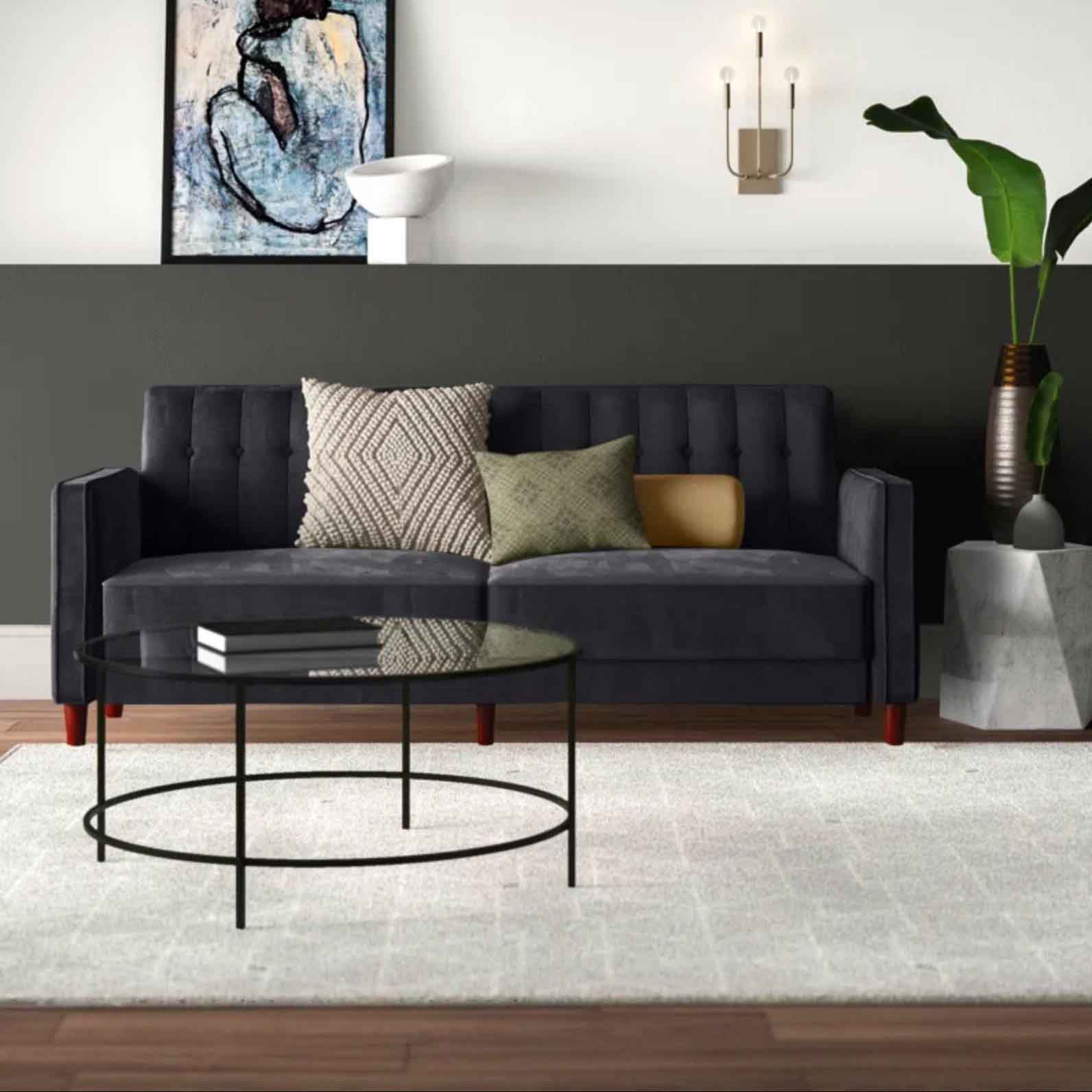 Grey velvet sofa in living room setting