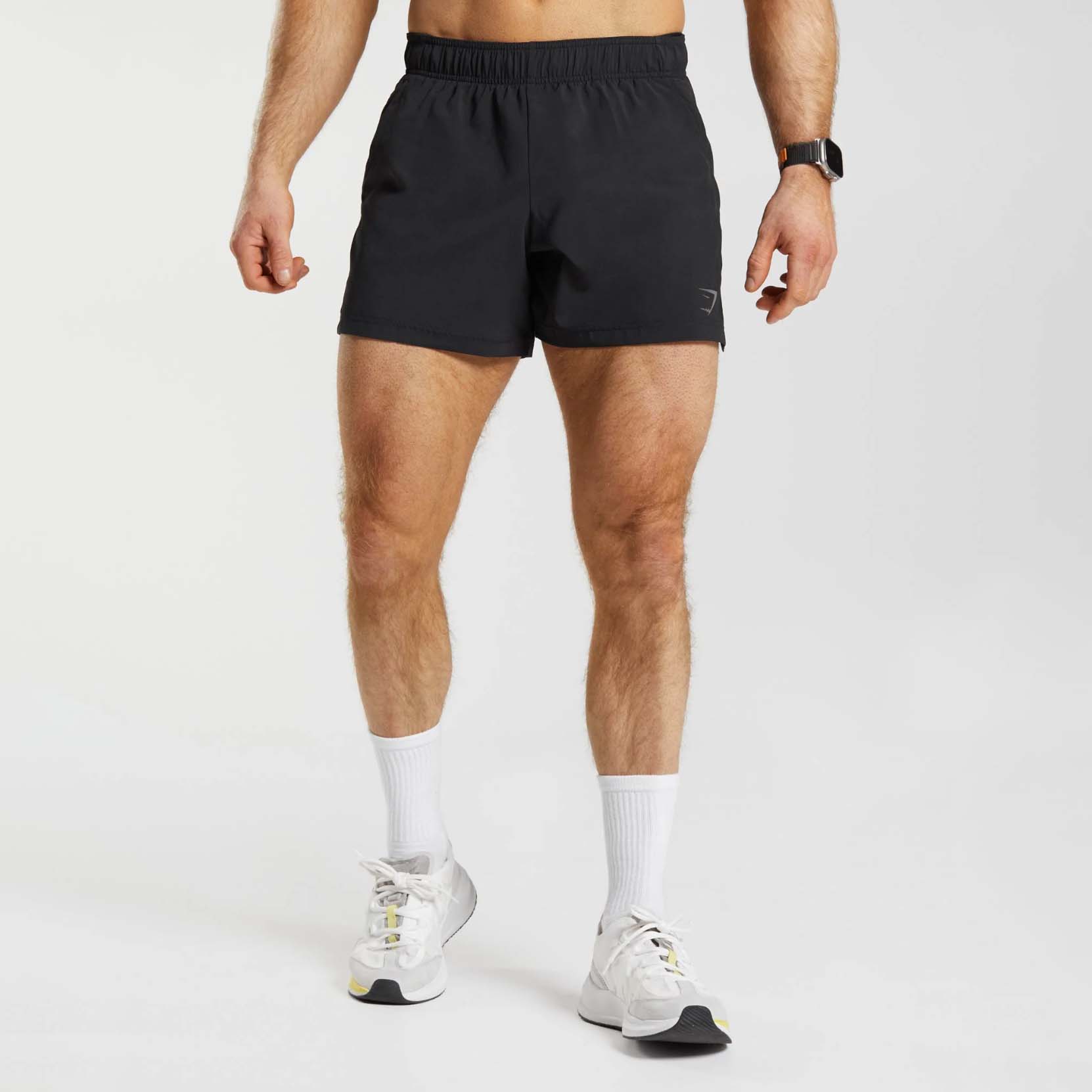 Men in very short black gym shorts