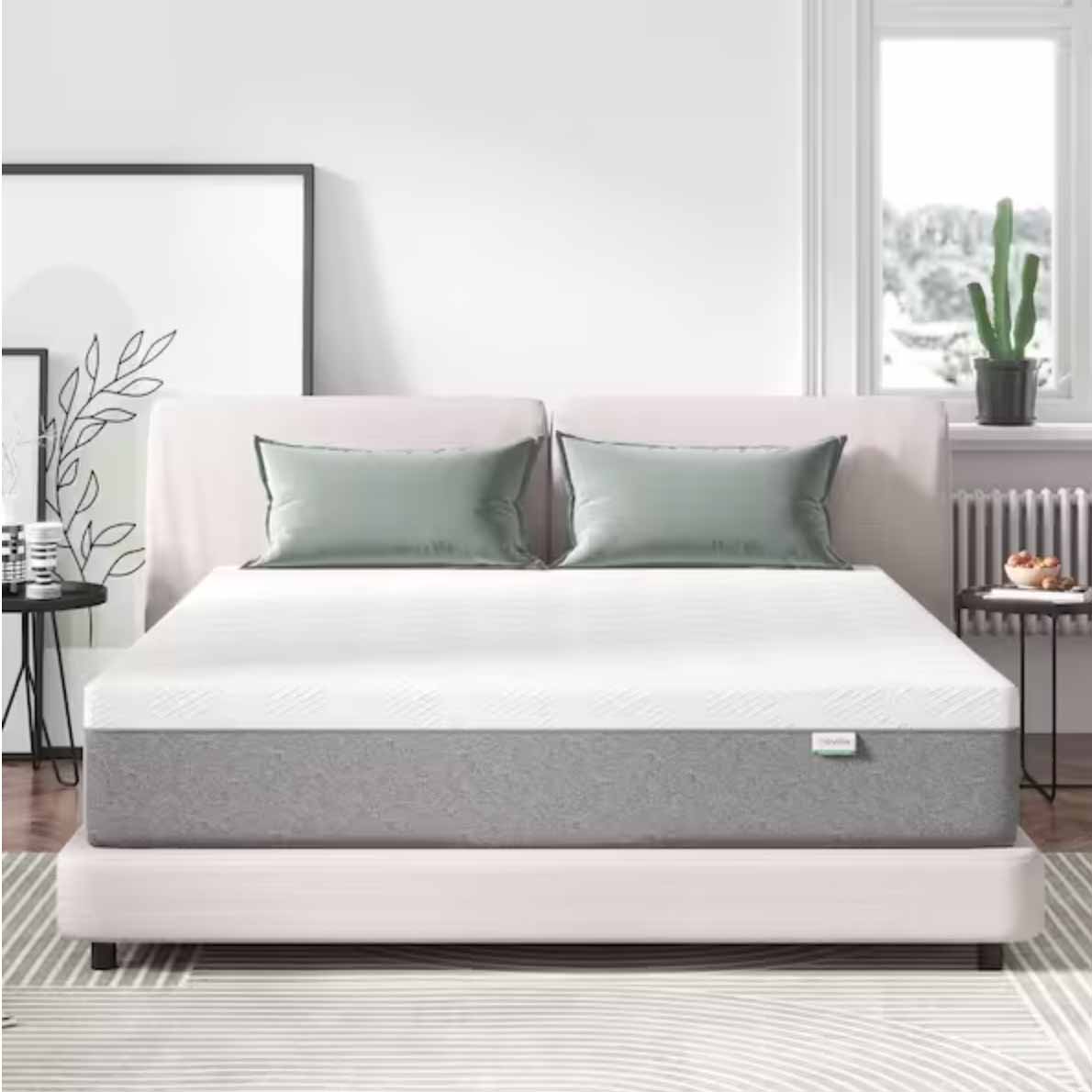 Gel memory foam queen mattress on a light grey bed frame with two silk pillows