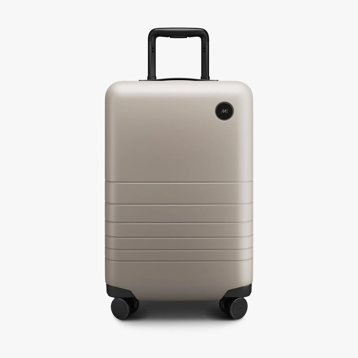 a taupe coloured suitcase with a black handle and wheels