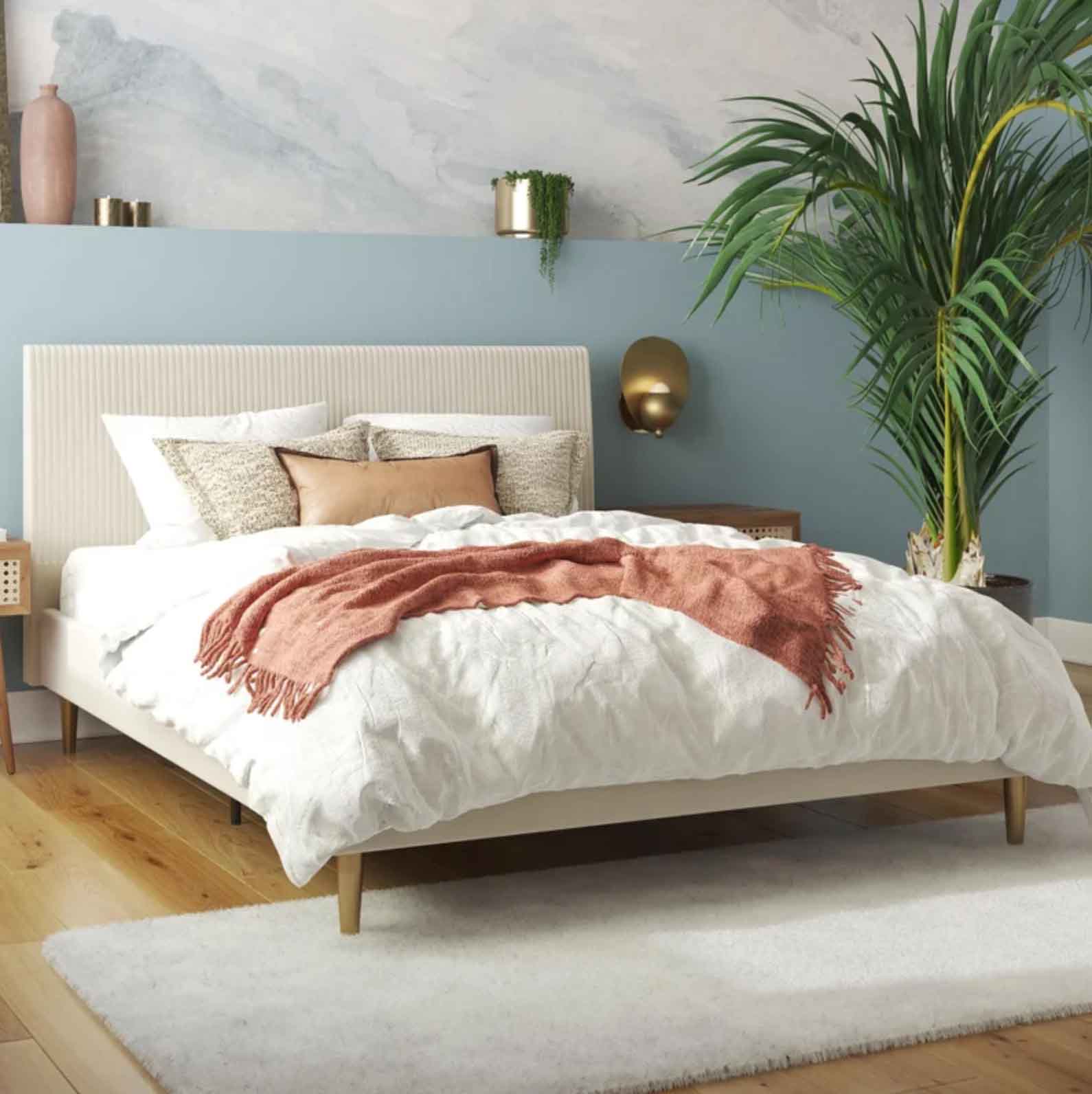 Cream-colored upholstered bedframe in bedroom setting