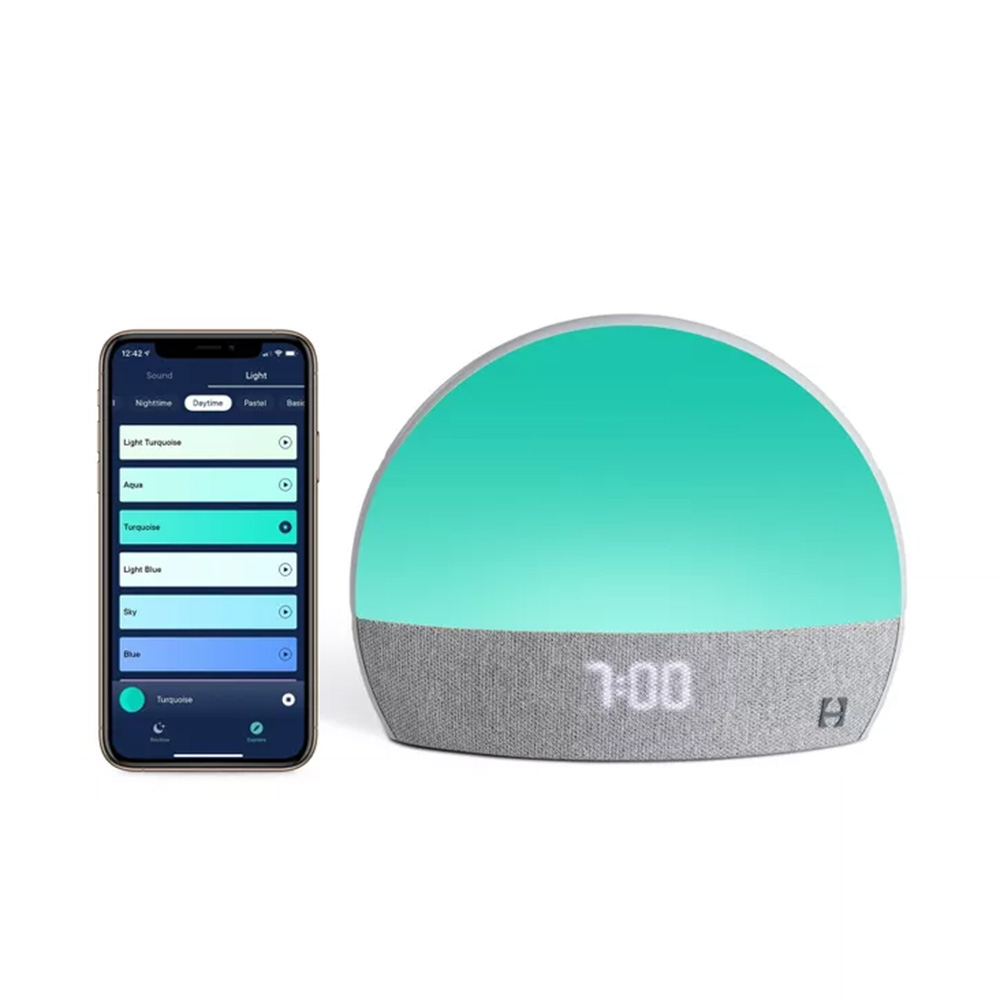 Hatch Restore Personalized Sleep Solution in grey and green reading '7:00' next to a smartphone