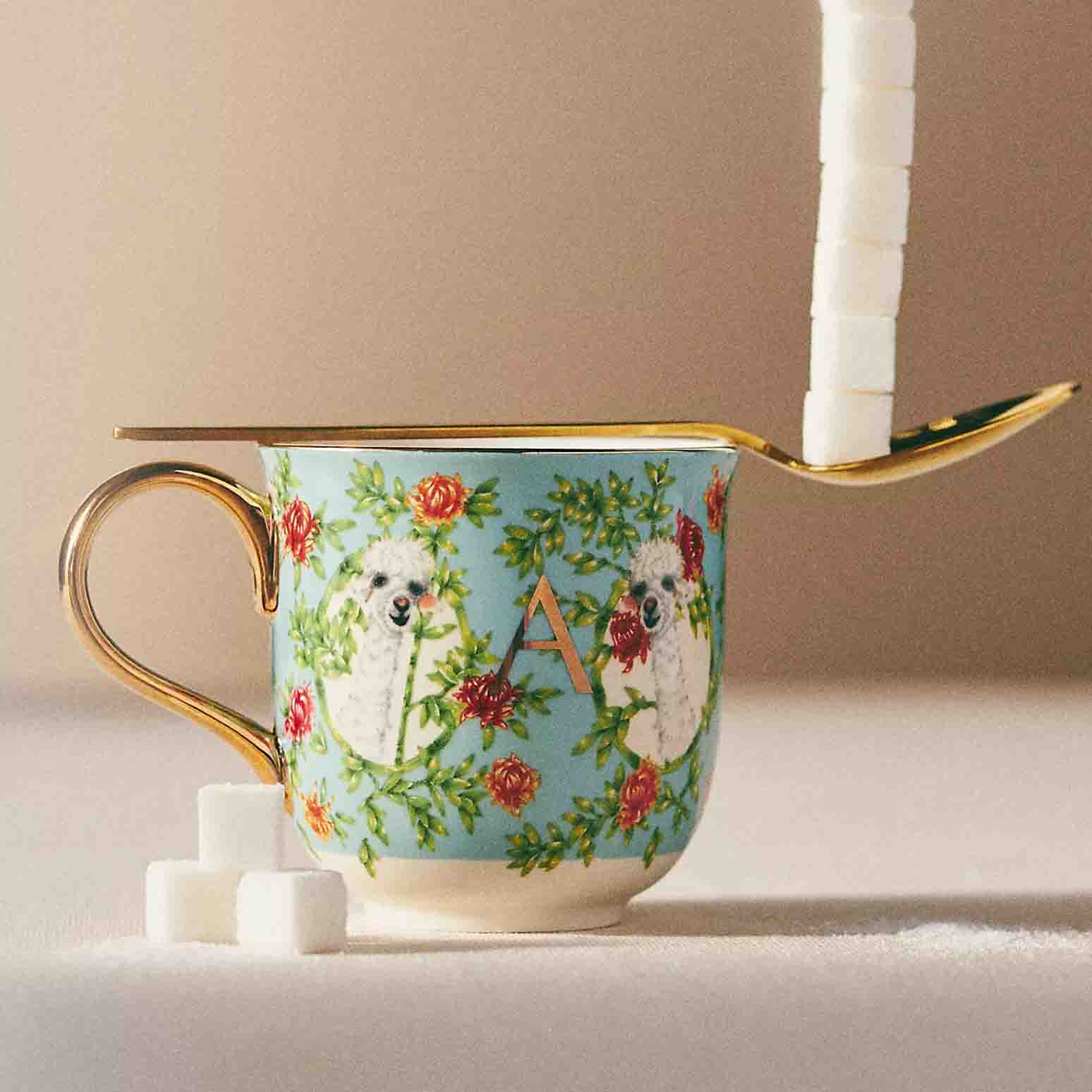 Lou Rota Nature Table Monogram Mug with a gold spoon and cubes of sugar