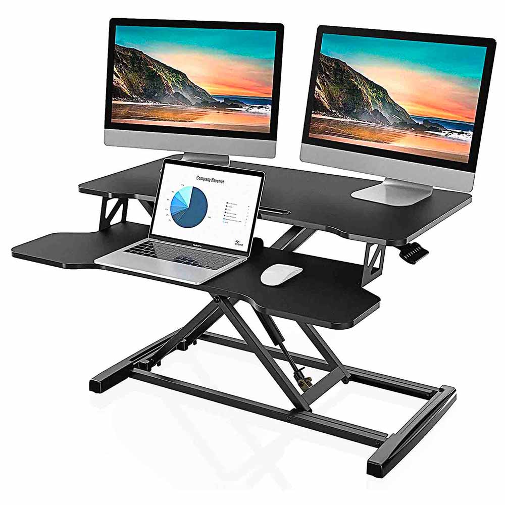 desk converter with two monitor and a laptop