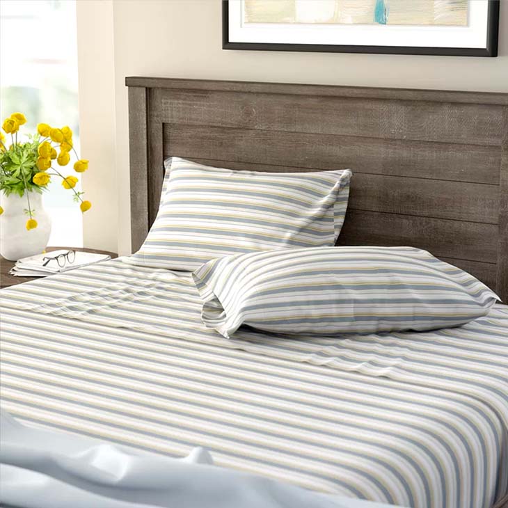 Striped bedsheet in bedroom setting
