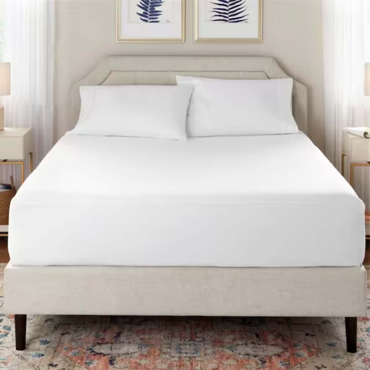 Stylewell Waterproof & Antimicrobial Fitted Full Mattress Protector on bed with gray frame