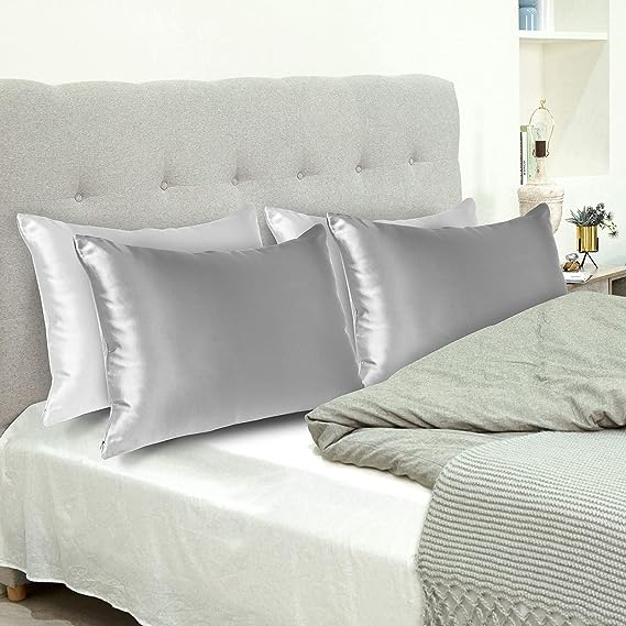 Grey J Jimoo 100- Mulberry Silk Pillowcase for Hair and Skin on a bed with blanket