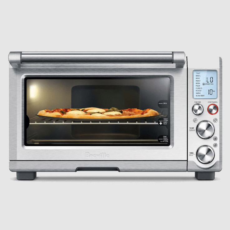 Silver Breville air fryer oven with pizza