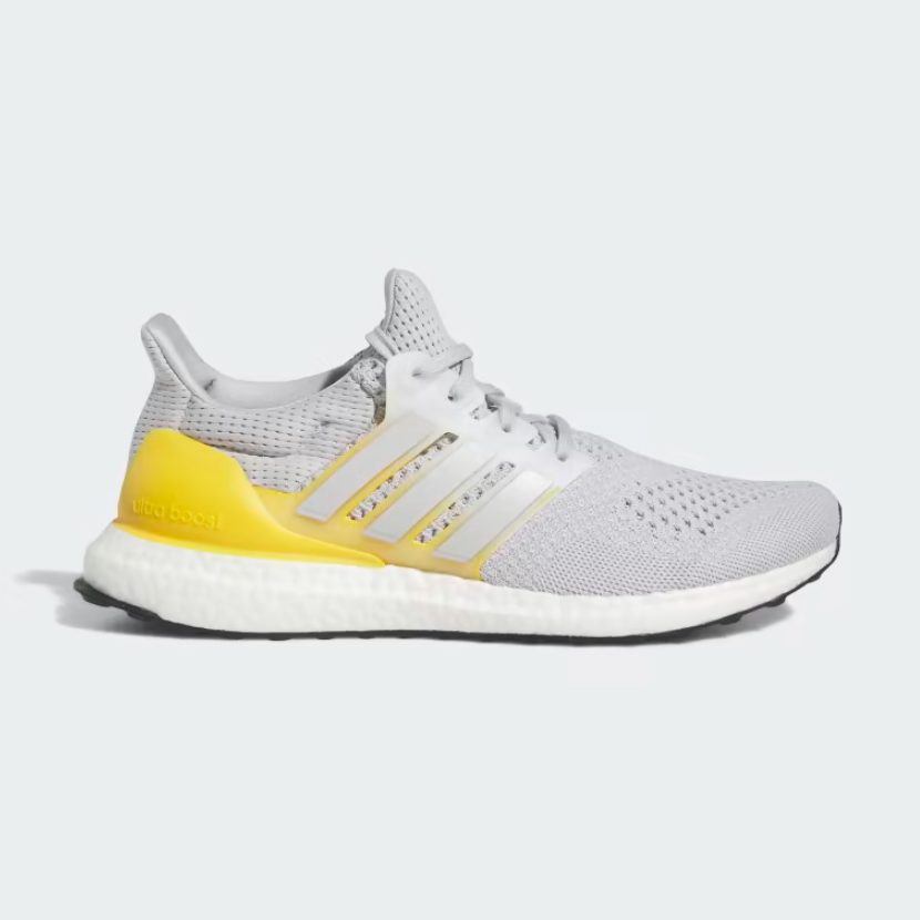 Adidas Ultraboost 1.0 in grey and yellow against a white background