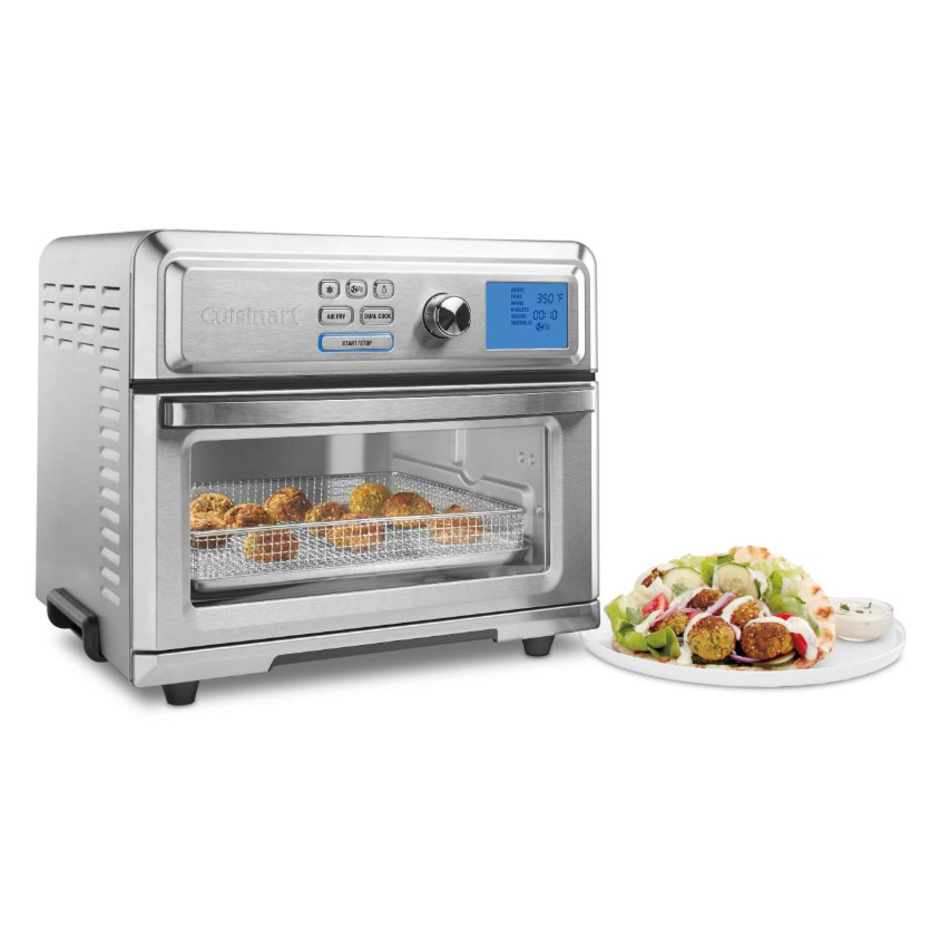 Silver air fryer oven toaster and image of salad on a plate