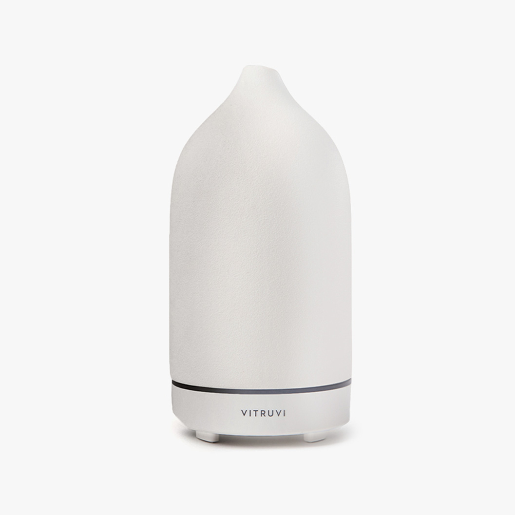 white essential oil diffuser with a timer button 