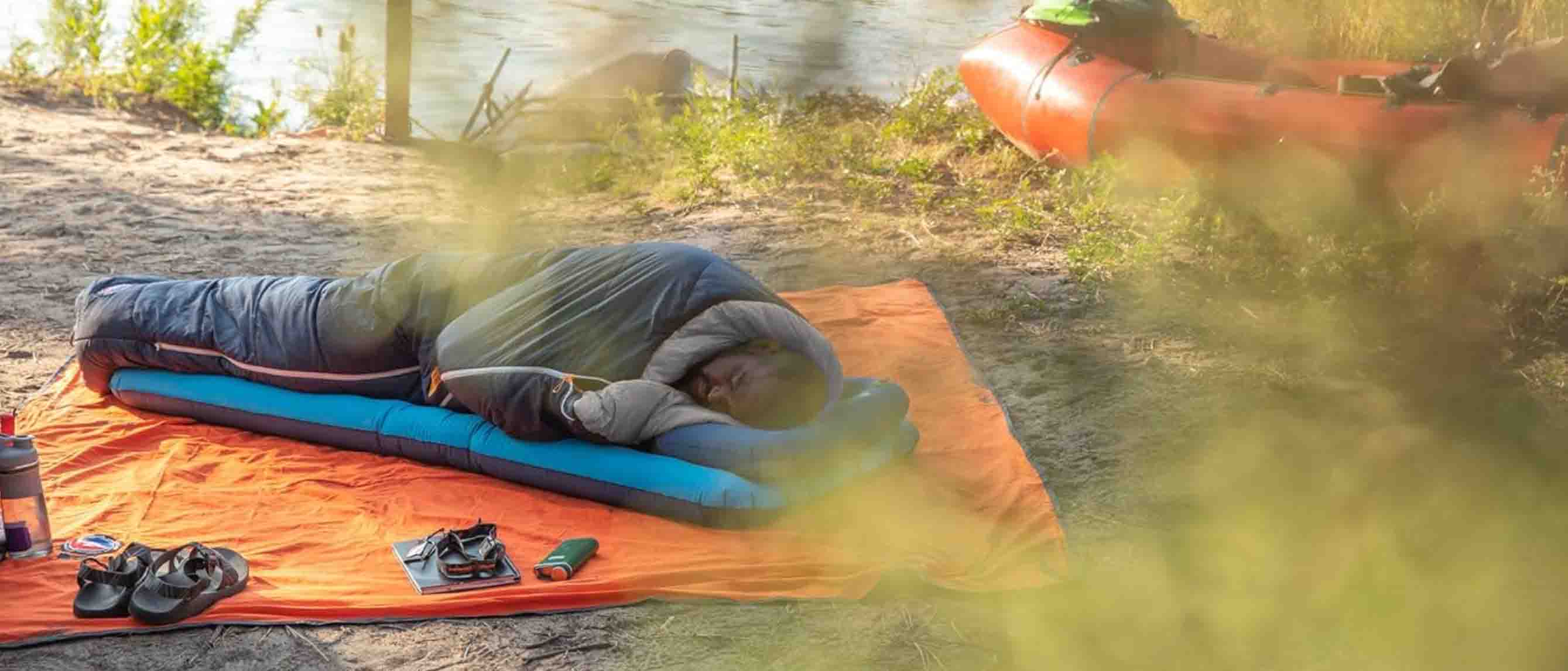 Man sleeping outdoor in sleeping bag