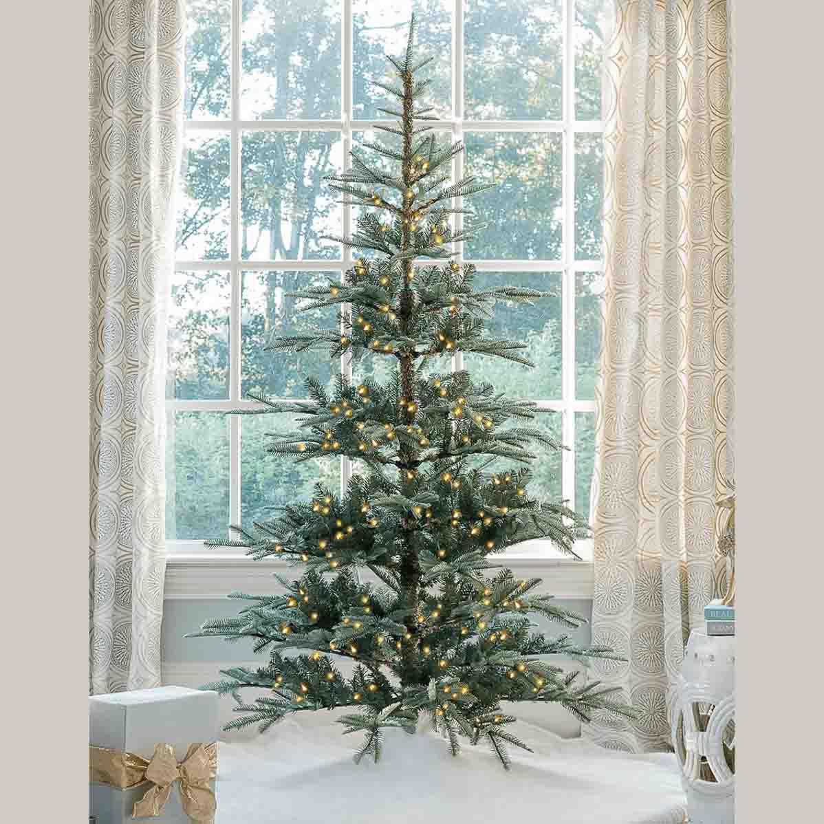 a 7 foot Noble Fir Artificial Christmas Tree with 500 warm white LED lights in a living room