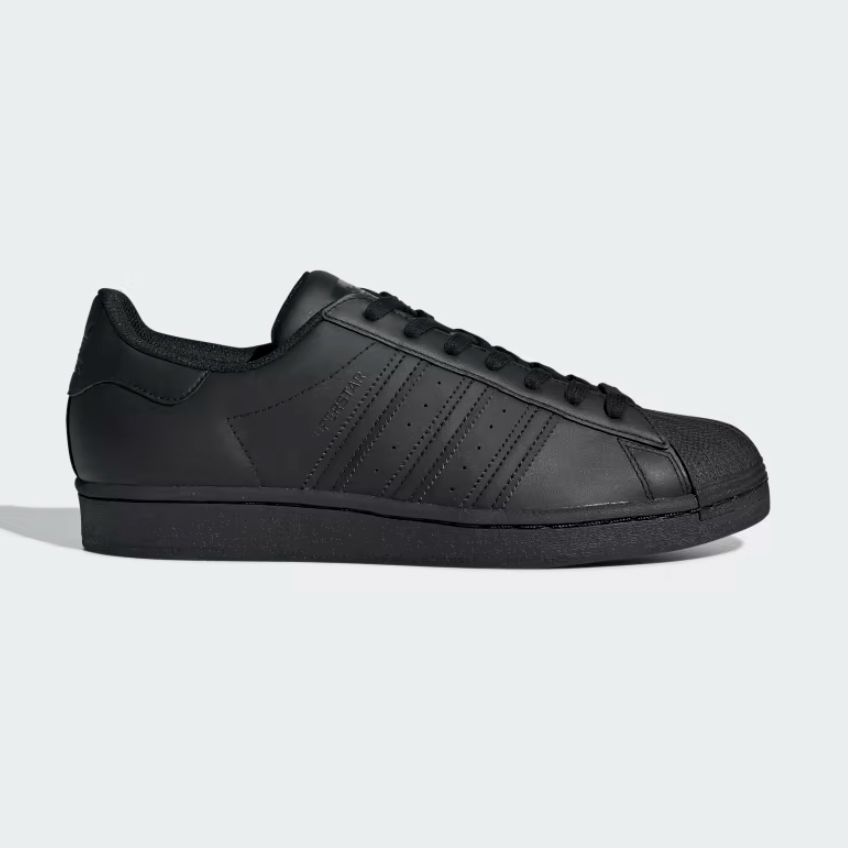 All-black Adidas Superstar against a white background