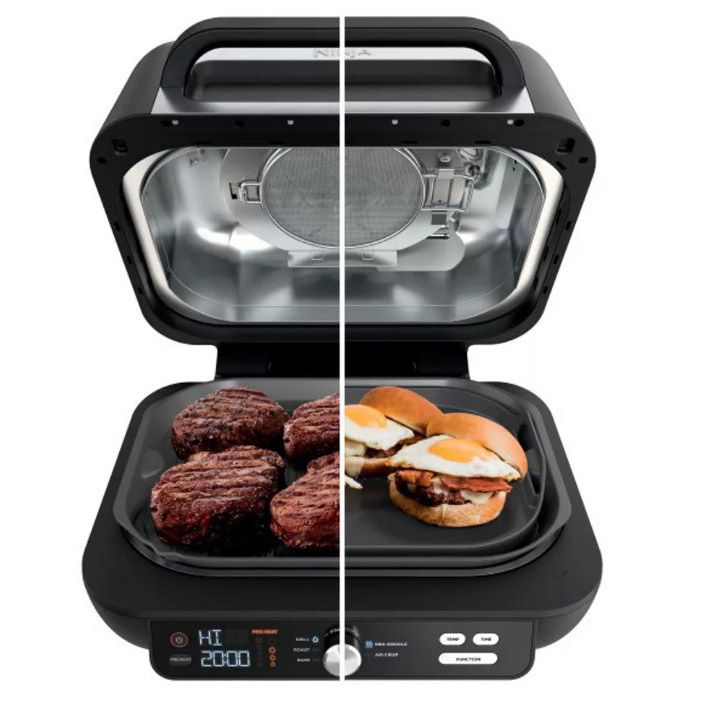 Image of Ninja barbecue grill with burgers on one half and egg sandwich on another half
