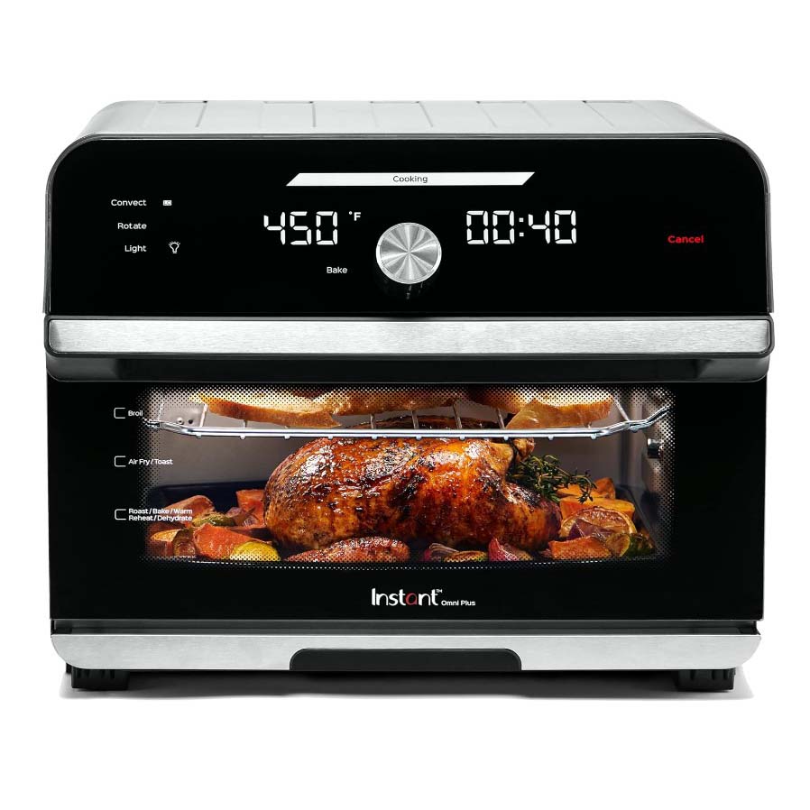 Black air fryer oven with roasted chicken