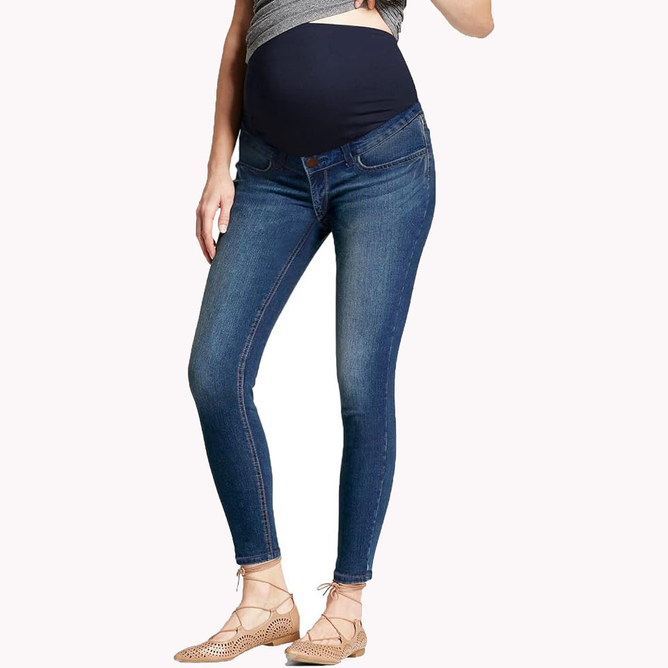 Half body image of model wearing stretching maternity jeans