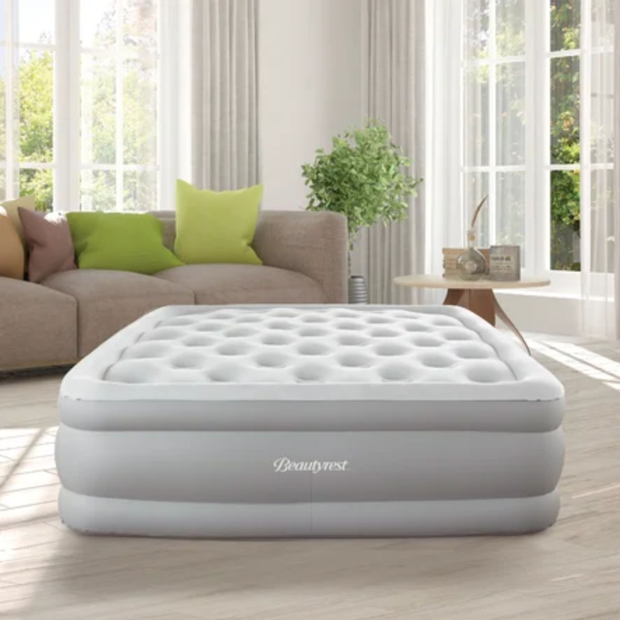Inflated air mattress in living room