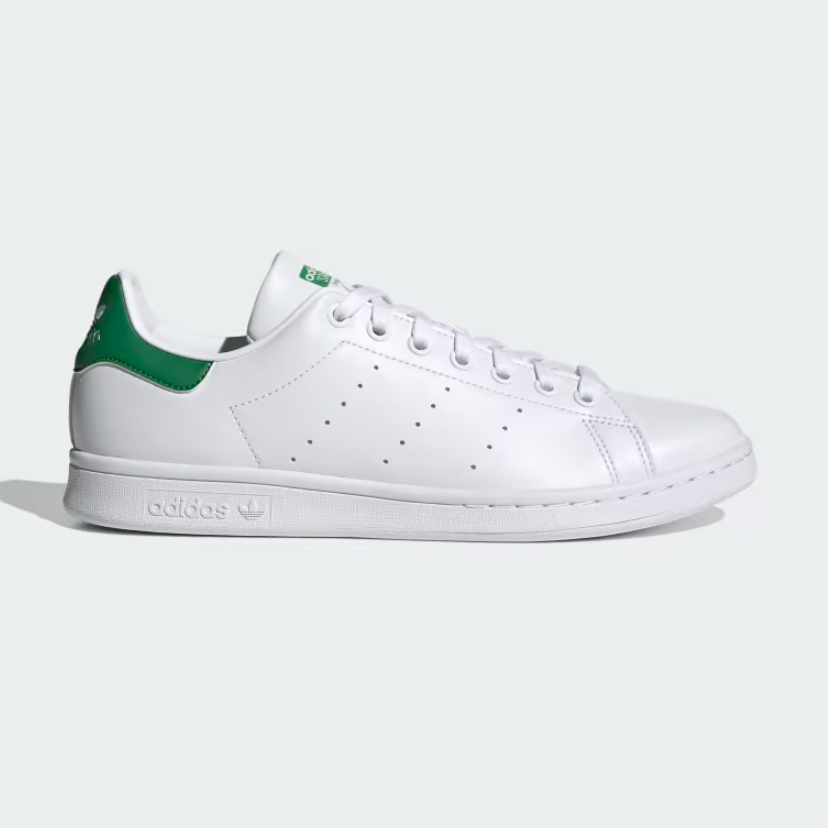 Adidas Stan Smith with green ankle accent against a white background