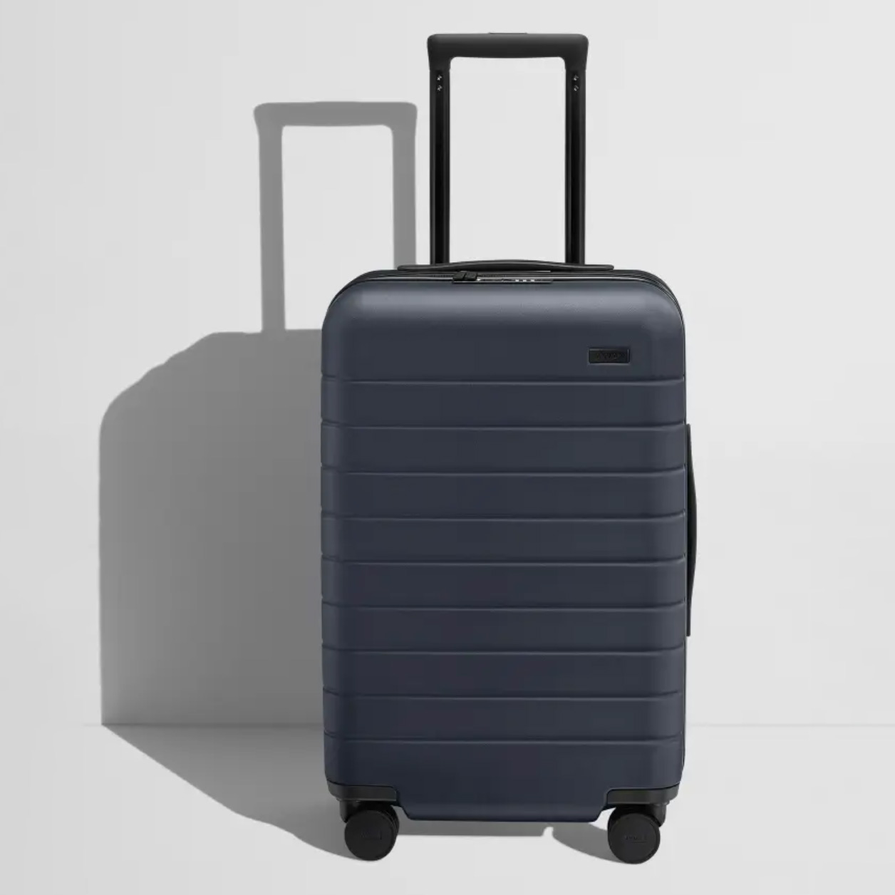 Front view of black hardside carry-on luggage