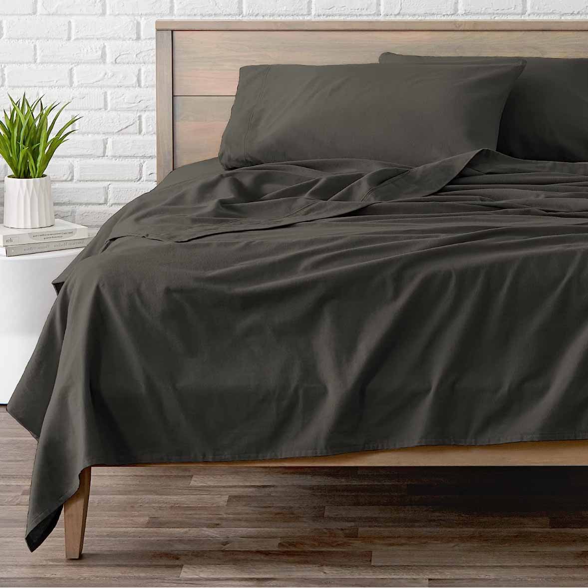 Black flannel sheet fitted on bed