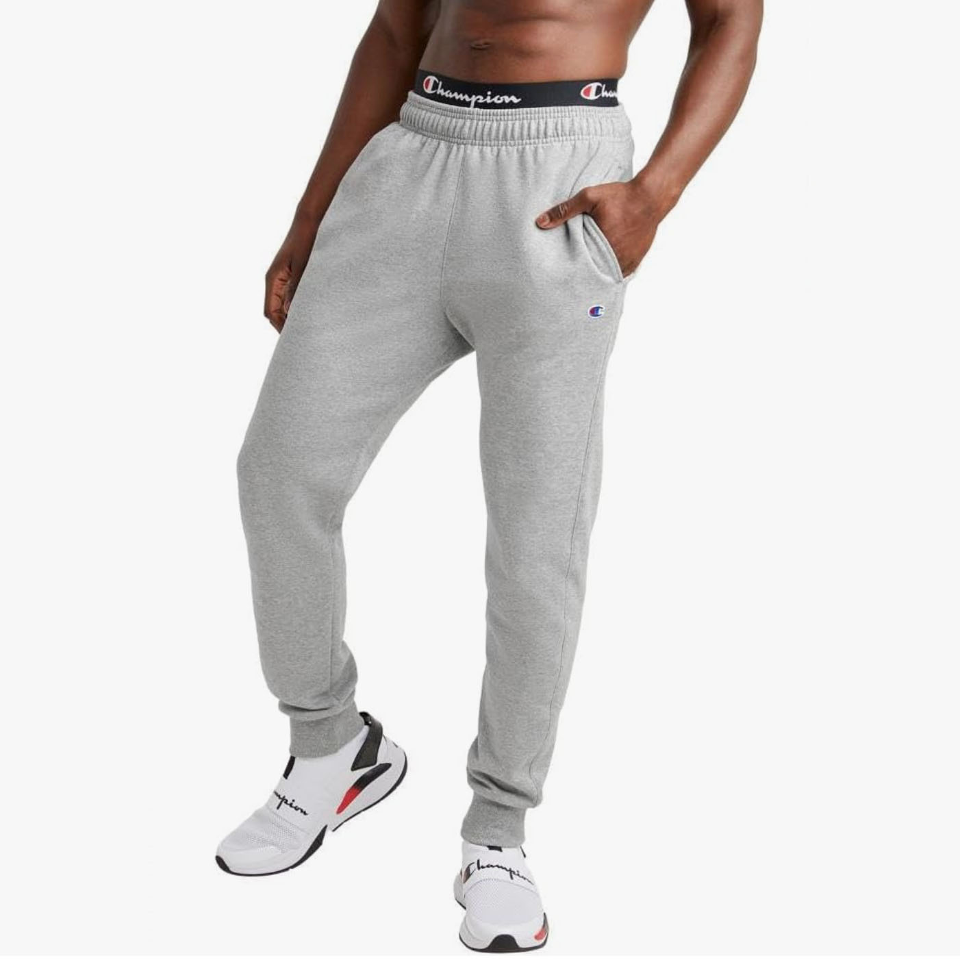 Mean wearing grey sweatpants with Champion's logo