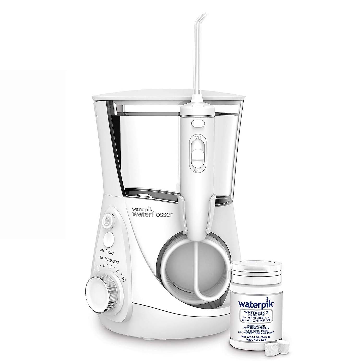 whitening water flosser with large basin and bottle of whitening tablets